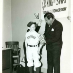 Babe Ruth and Boy in Baseball Uniform