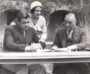 Babe Ruth Signing Contract with Colonel Ruppert with Babe's wife Claire Looking On