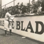 Babe Ruth Signing Autographs in the Bleachers
